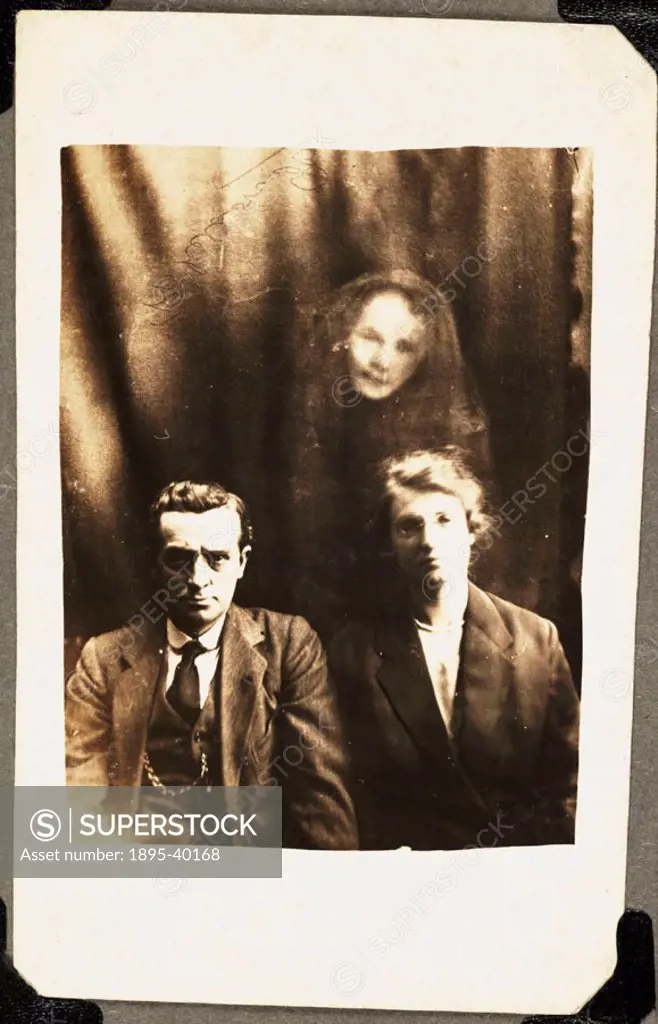 A photograph by William Hope (1863-1933). A woman´s face appears above the couple - identified at the time as the sister of a man prominent in the Spi...