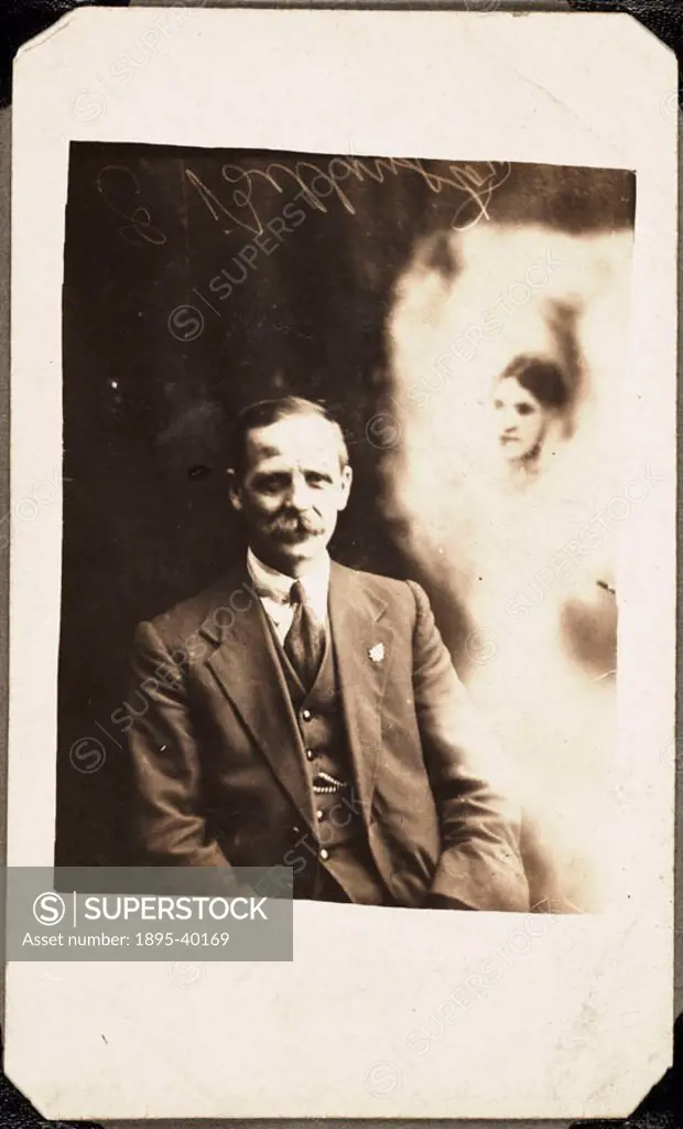 A photograph of a man, taken by William Hope (1863-1933). A woman´s face appears in a ´misty´ cloud to the right of the man - identified as that of hi...