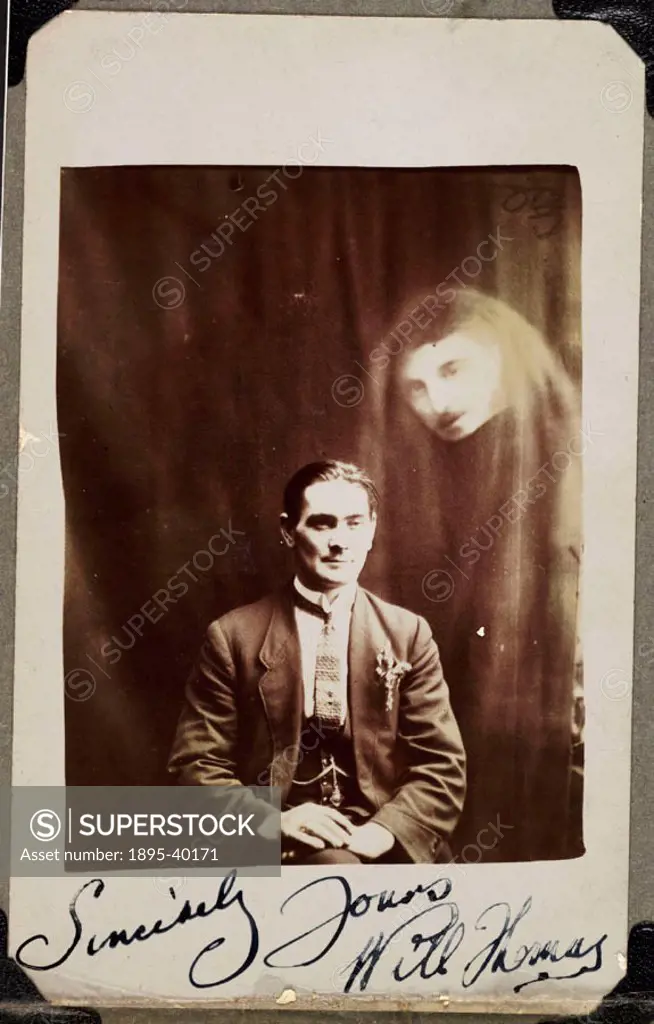 A photograph of Will Thomas, taken by William Hope (1863-1933). A man´s face appears in a haze of drapery on the right of the photograph. Thomas, a me...