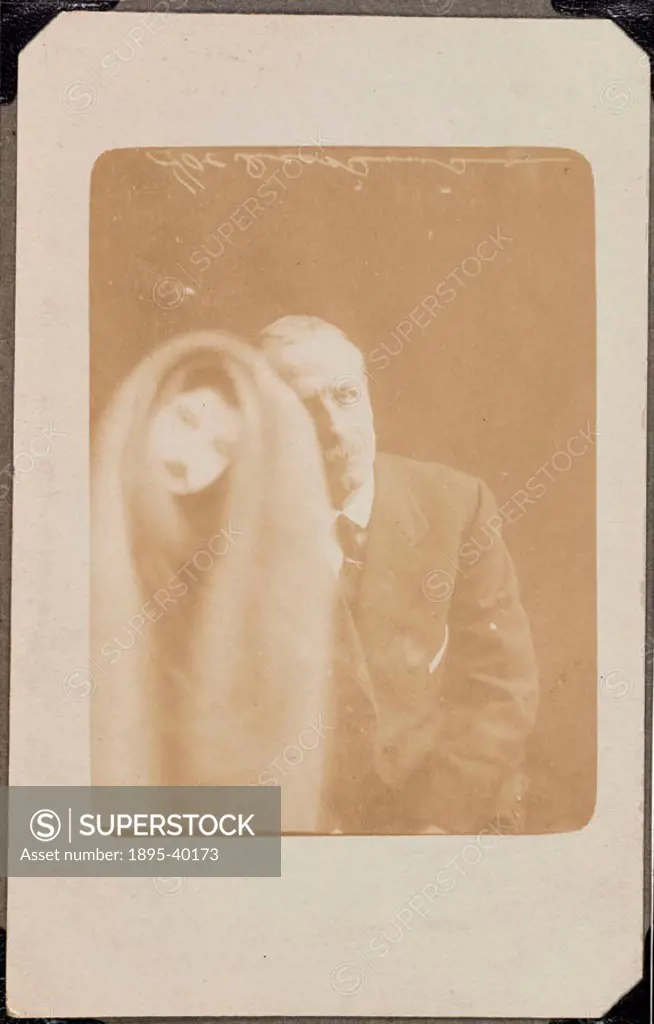 A photograph of an elderly man, taken by William Hope (1863-1933). A face appears over the man´s image on the left of the photograph, covered in a clo...