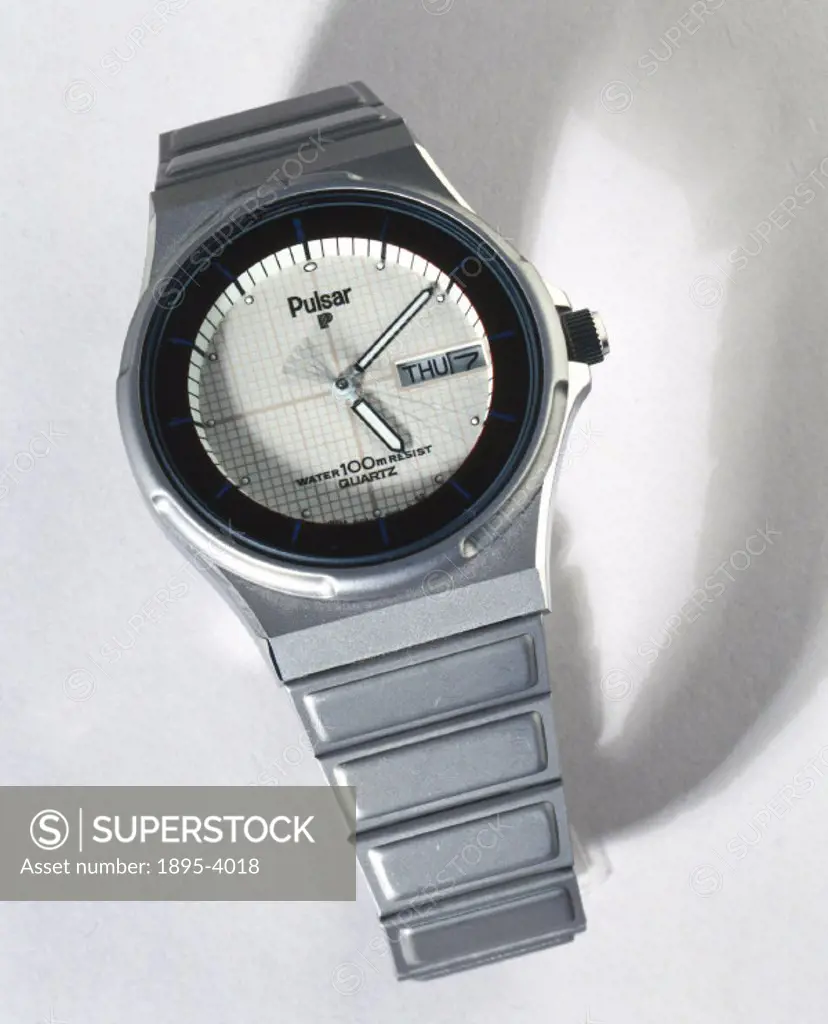 Made by Pulsar Quartz of Switzerland, this wristwatch is powered by an amorphous silicon photocell (which surrounds the dial) with reserve power provi...