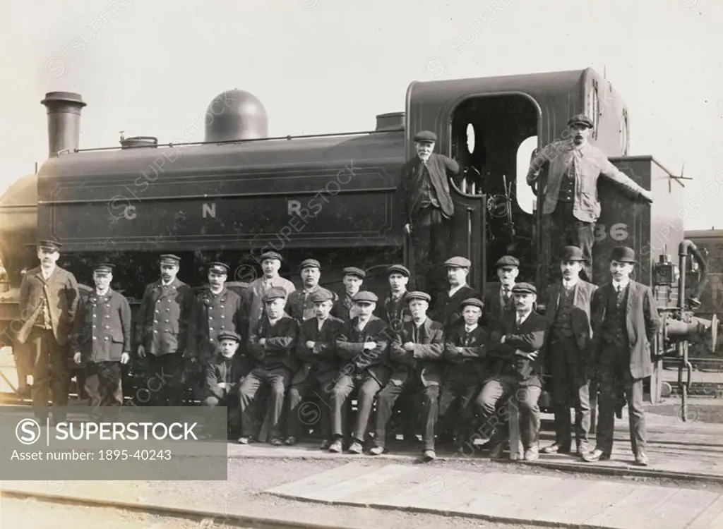 Doncaster Railway works staff beside a tank locomotive number X36, about 1916. The workers are shunters, and move rolling stock around the works site....