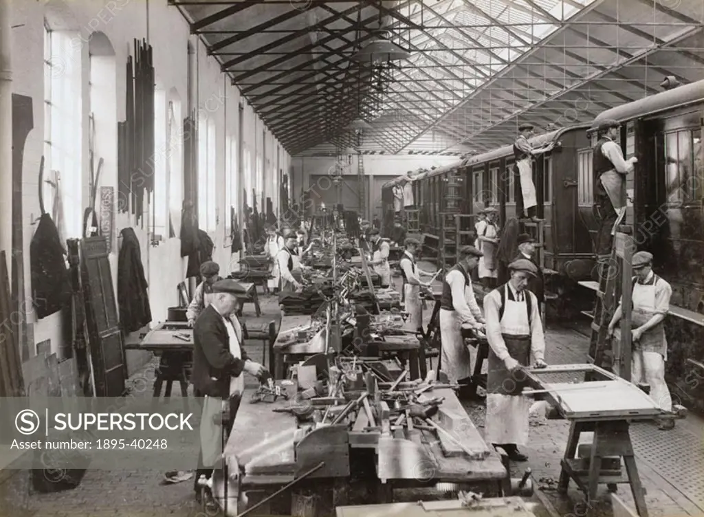 Workers repairing carriages at Doncaster carriage works. At this time carriages were made from wood but some were starting to be manufactured from iro...