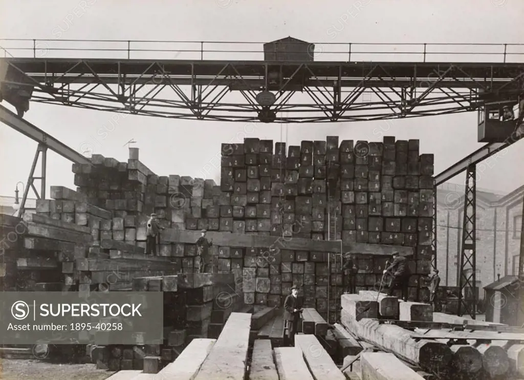 Timber stacks at Doncaster carriage works. Above the timber is a crane which lifted the wood. At this time carriages were still made from wood althoug...