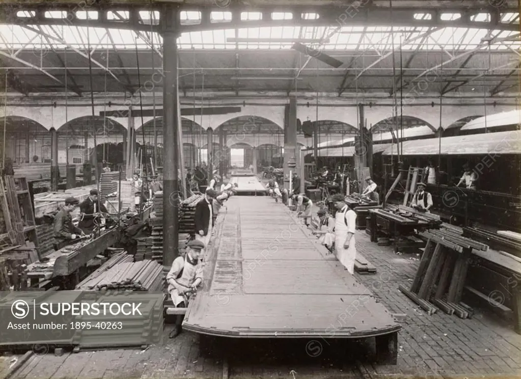 Workers manufacturing wooden carriages at Doncaster carriage works. At this time carriages were still made from wood but iron and steel carriages were...