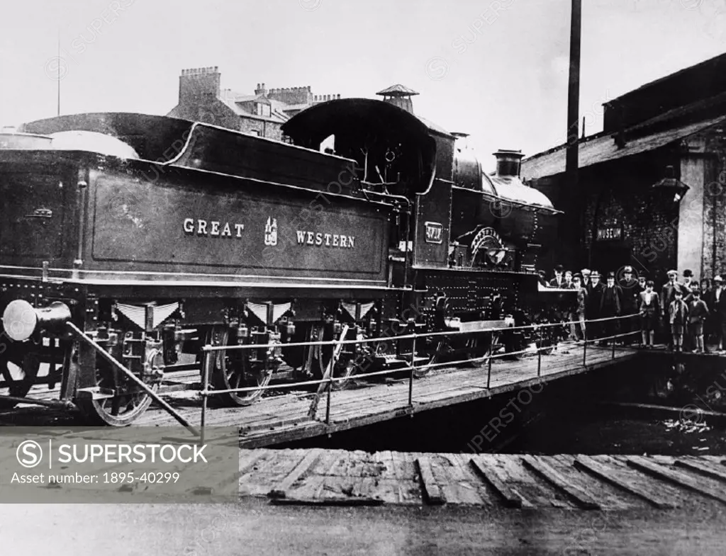 A 4-4-0 locomotive number 3717, City of Truro’ on a turntable in a museum, about 1925. This Great Western Railway locomotive was the first locomotive...