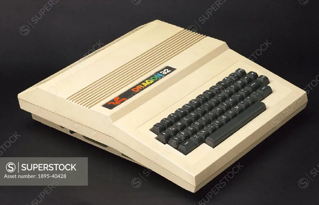 Dragon Data Ltd model 32 Family Computer, introduced in 1982, serial number 067487DG, with AC power supply module, two joystick controllers and two us...