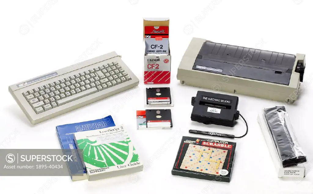 Amstrad PCW 8256 word processor and printer with user guides, floppy discs, light pen, printer cartridge and Computer Scrabble game.
