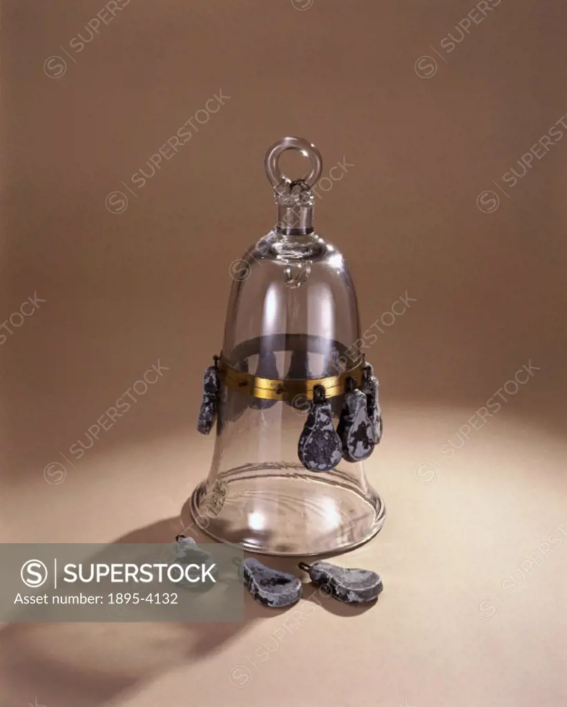 This is a standard diving bell model of the mid 18th century. It has twelve lead weights which kept it submerged, three of which are shown detached. T...