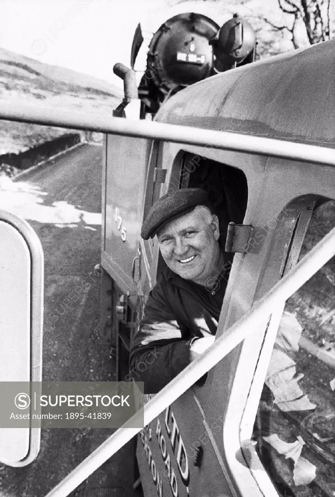 Lorry driver Jim Goulding of Sunter Brothers Ltd, delivers Adolf Hitlers personal locomotive to the steam engine museum at Carnforth, Lancashire.