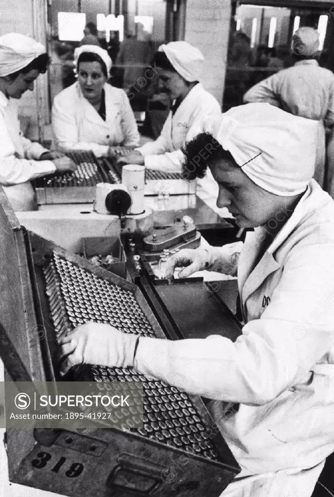 Women on a production line in a factory manufacturing the antibiotic penicillin at Speke, Liverpool.