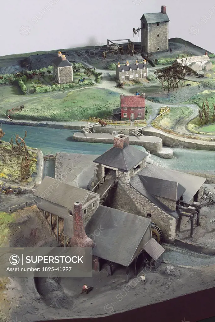 Model (scale1:72) representing an 18th-century British landscape, in the foreground is a charcoal burning factory or possibly an ironworks. A boat is ...