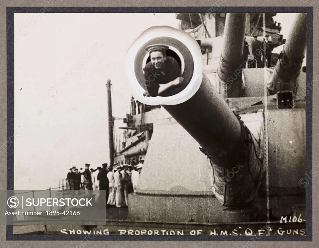 A photograph of a sailor lying in the barrel of 15 inch gun,  taken by an unknown photographer in about 1916. This photograph is from an album entitle...