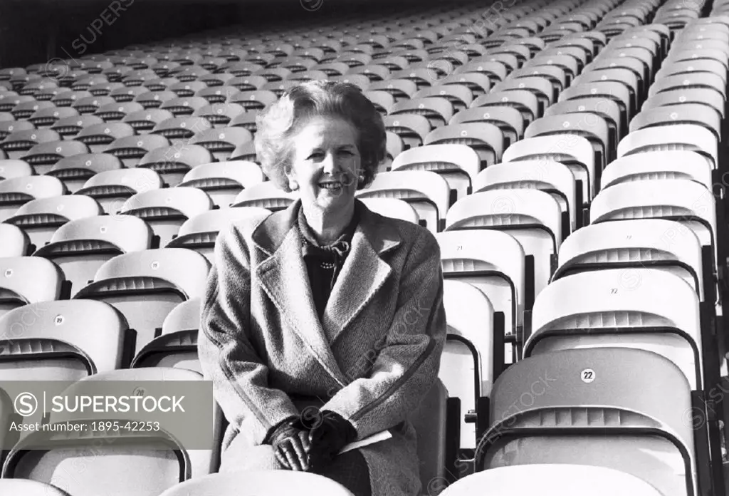 Mrs Thatcher tries out the seats in the new stand at Bradford FC’. Margaret Hilda Thatcher (b 1925) studied chemistry at Oxford University, and worke...