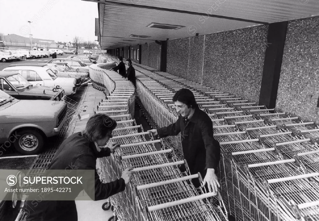 Preparing the trolleys for the opening day invasion...there are 2,000 which cost £40,000.’