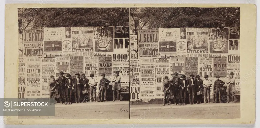 Albumen print. Stereoscopic card by E & H T Anthony of New York, of shoeshine boys posing against an advertising hoarding. Some of the attractions inc...