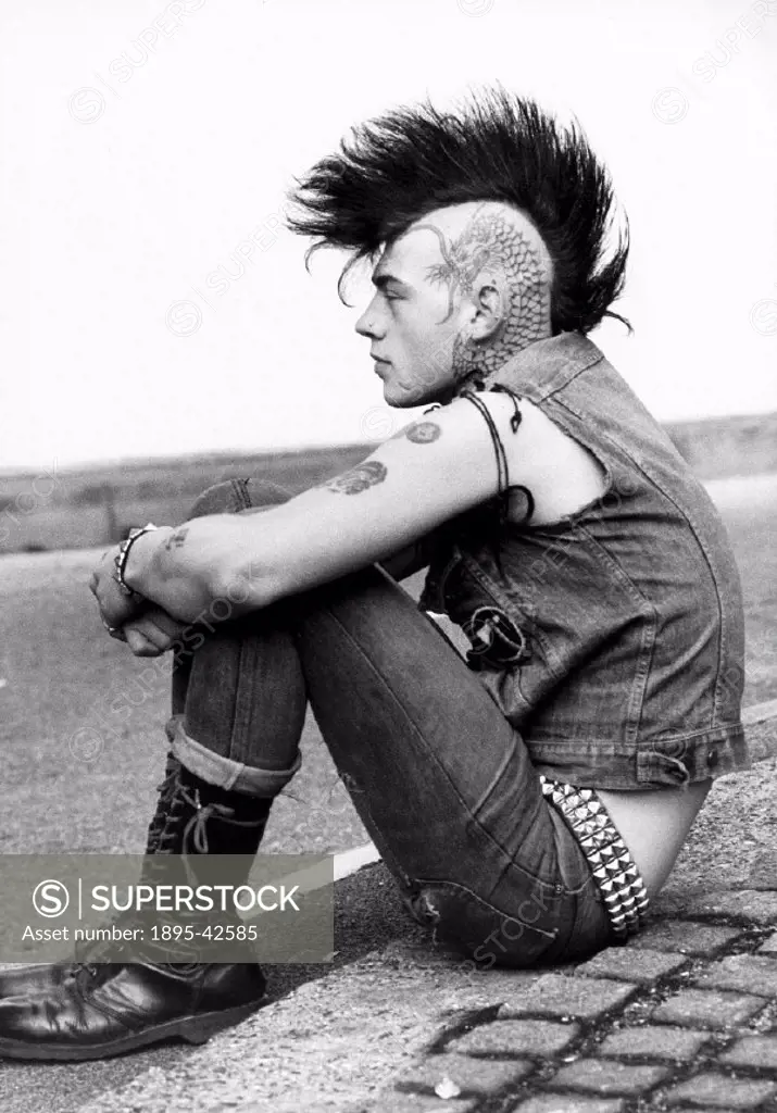 British punk with tattoos, Mohican hairstyle and piercings.