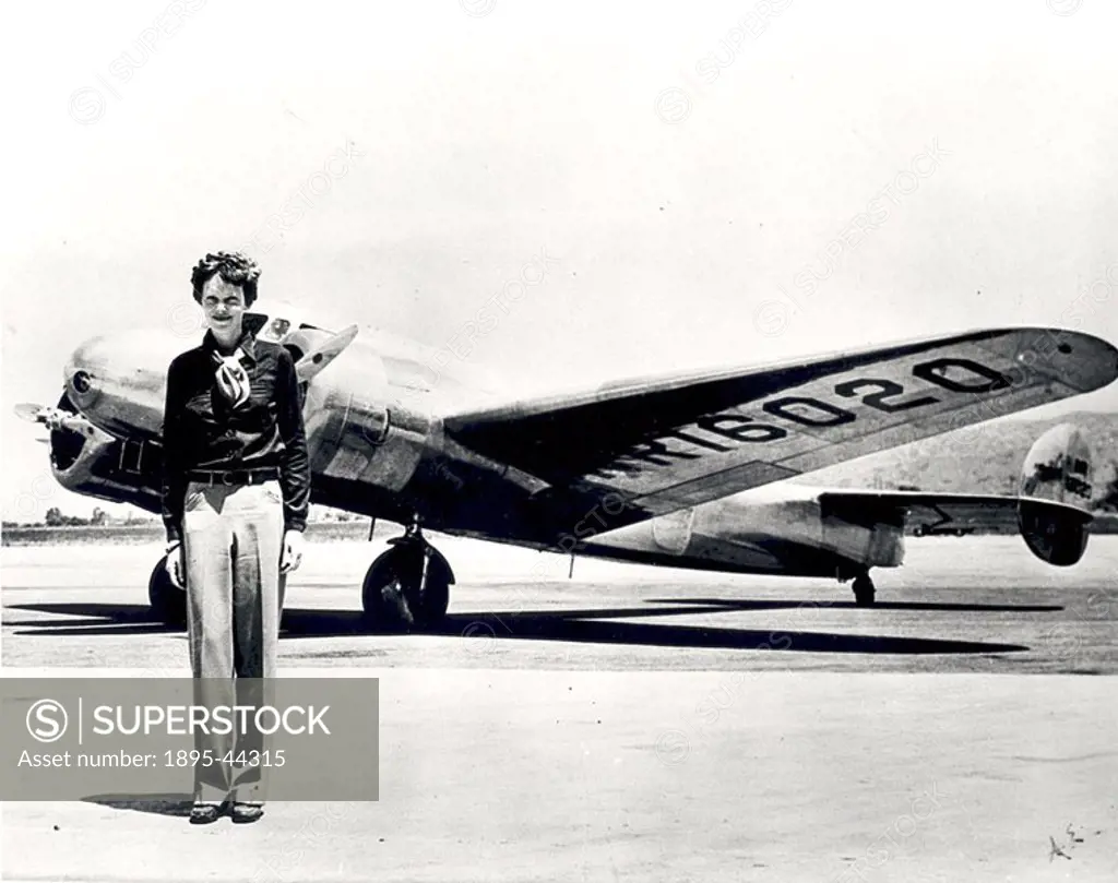 American aviator Amelia Earhart, c 1930s Earhart born 1897 standing in front of the Lockheed Electra in which she disappeared in 1937  Earhart began f...