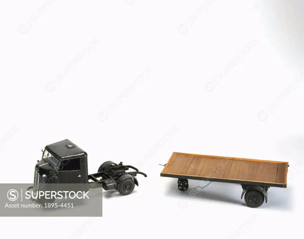 Model (scale 1:10). The tractor is shown with a four-ton trailer. This type of vehicle was built to transport goods over short distances. The engine, ...
