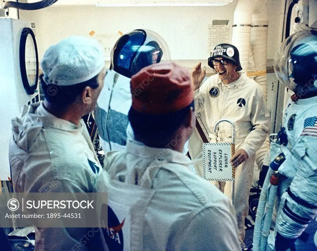 Astronauts joking around before Apollo 14 mission, 31 January 1971 In the White Room, Pad Leader Guenter Wendt proudly wears a ´Col Guenter Klink´ hel...