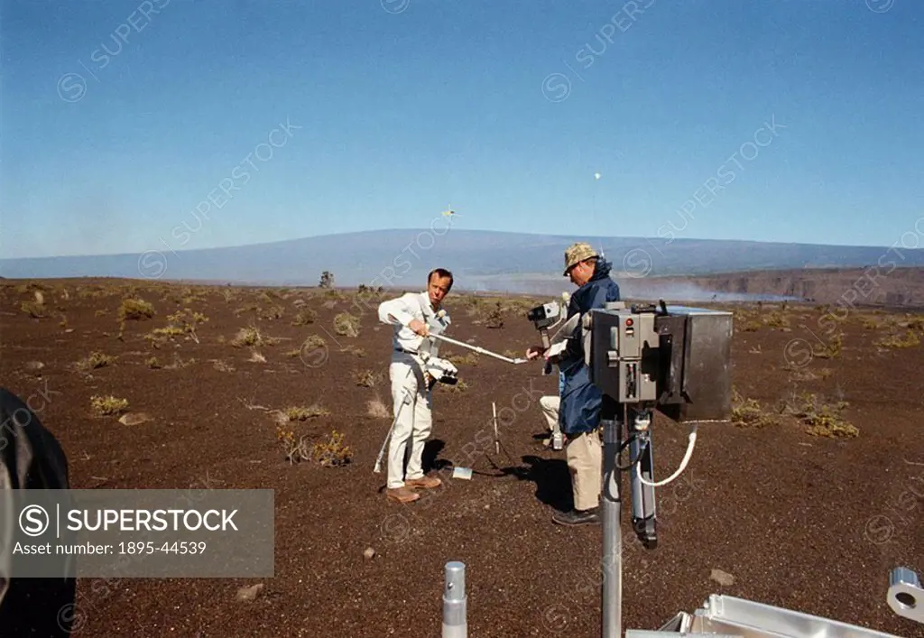 Practicing sampling of geological specimens, 1970 Astronauts in training for the Apollo 14 Moon landing  Al Shepard left holds the scoop high enough t...