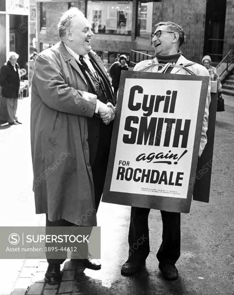 Cyril Smith, Liberal party politician, with a sandwich board man.
