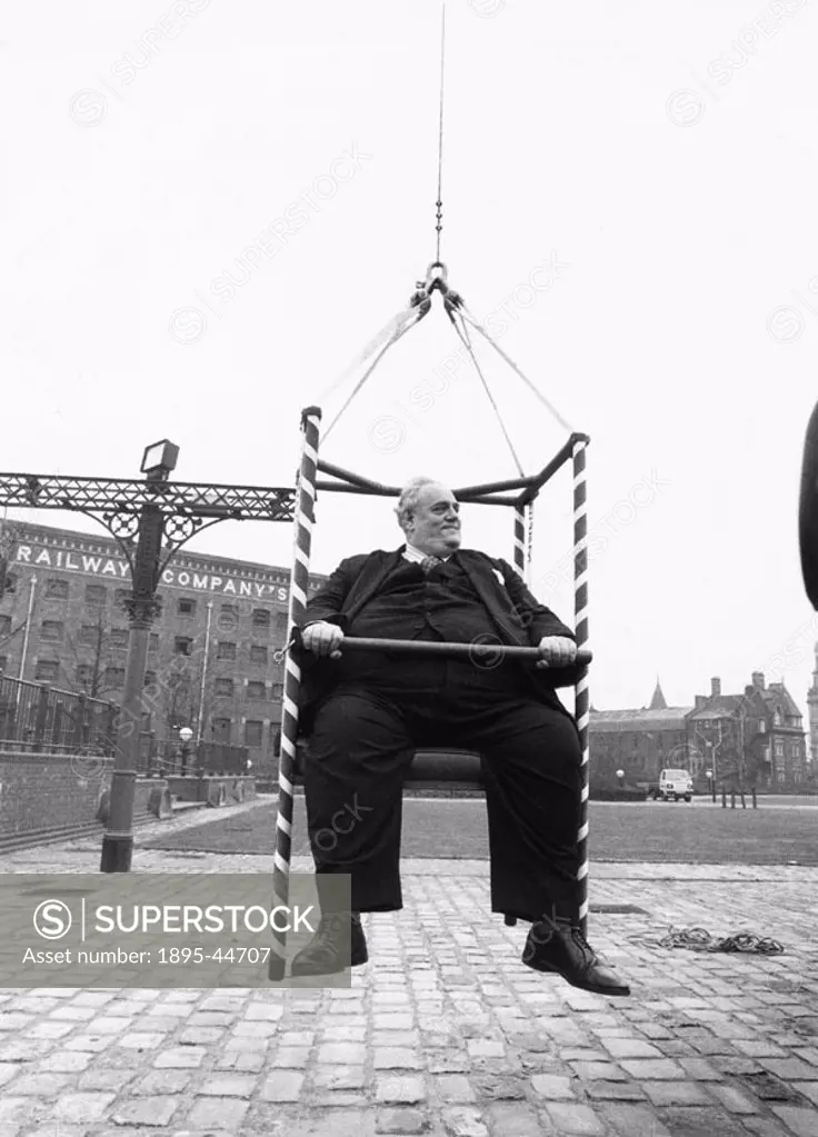 Cyril Smith hanging by a thread at G-Mex. The 28-stone Liberal MP was hoisted up in a special chair to prove the strength of a new pencil-thin rope a...