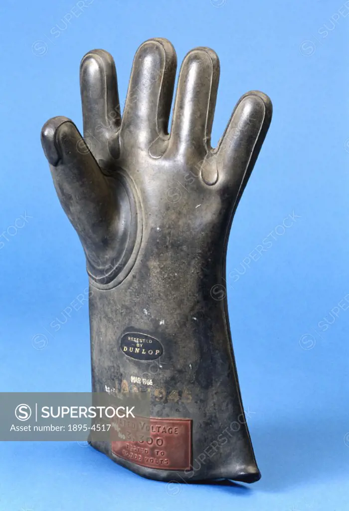 ´This rubber left hand protective glove was manufactured by Dunlop, and is labelled; ´Rated voltage 3300 tested to 15000 volts´. Rubber is a suitable ...