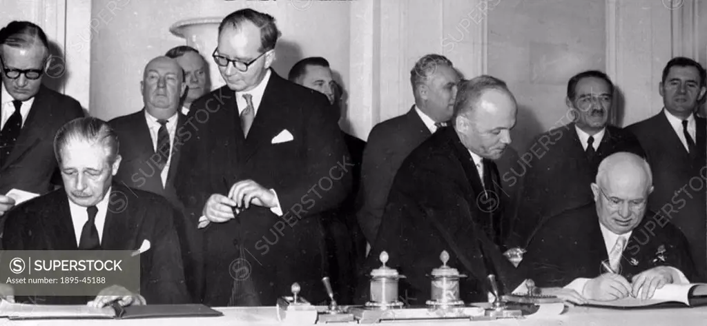 Macmillan and Khrushchev in the Kremlin, signing their final communique, before Macmillan returned by Comet aeroplane to Britain. Maurice Harold Macmi...