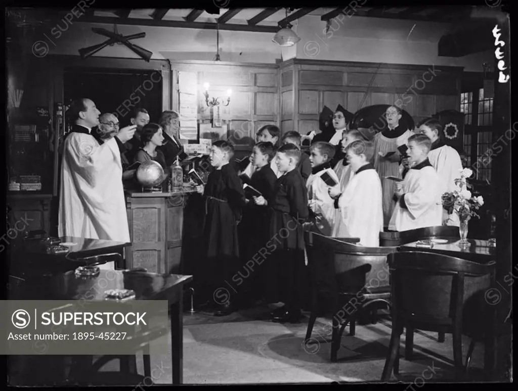 A choir rehearsing Christmas carols, Crispin Inn, Windsor Forrest, 1935.