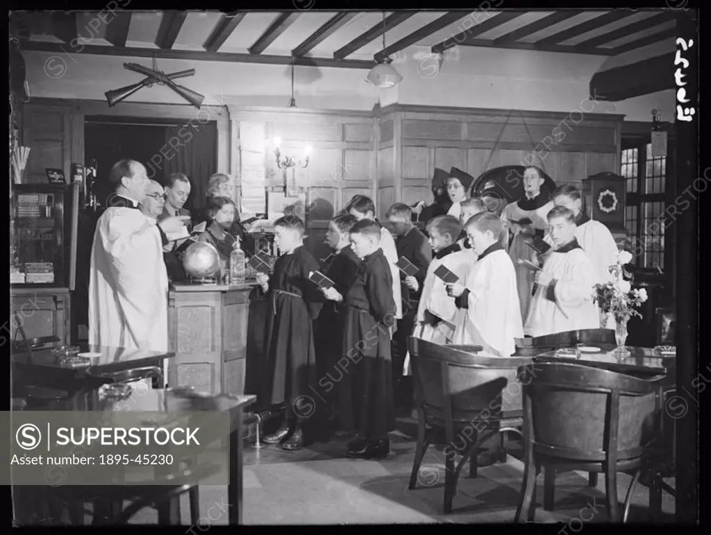 A choir rehearsing Christmas carols, Crispin Inn, Windsor Forrest, 1935.