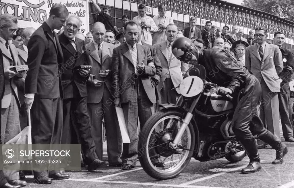 Prince Philip drops his starters flag and the previous years winner, A J Bell, moves off. The world-famous TT (Tourist Trophy) Motorcycle Races have...