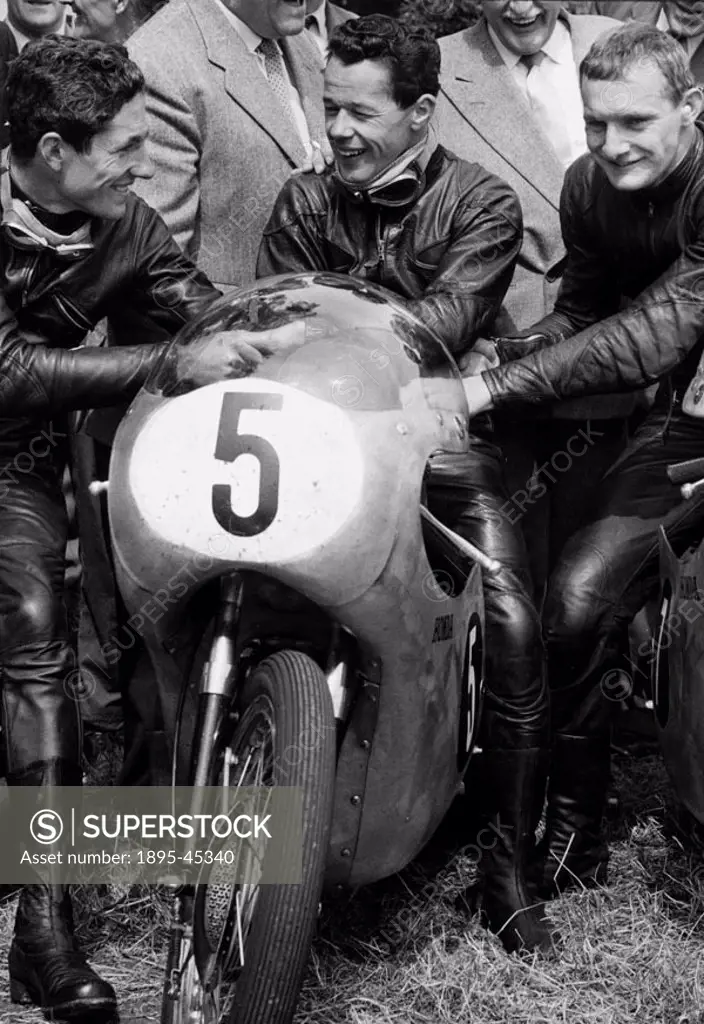Left to right: T Phillips, 3rd, Luigi Taveri (no 5), 2nd, and Mike Hailwood, the winner. Smiles from the 125 winners - it was on the corners that Hail...
