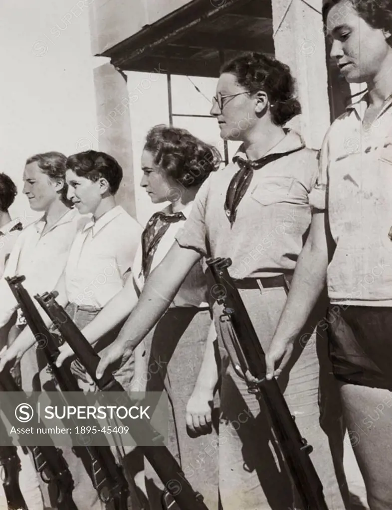 American women bear arms in a Jewish settlement in Palestine’. Photograph by the Daily Herald newspaper.