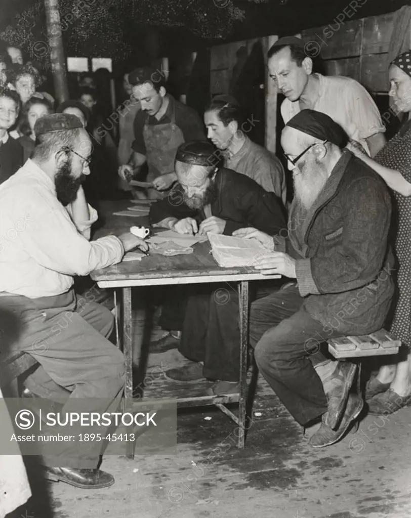 A Rabbi reads his Bible [sic: Jewish illegal immigrants from Hamburg’.