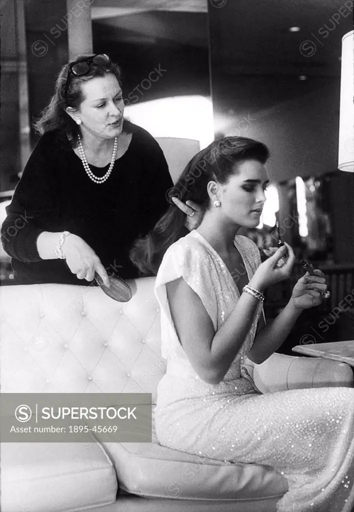 Brooke Shields and her mother Terri, May 1984 American film star Brooke Shields putting on makeup while her mother brushes her hair