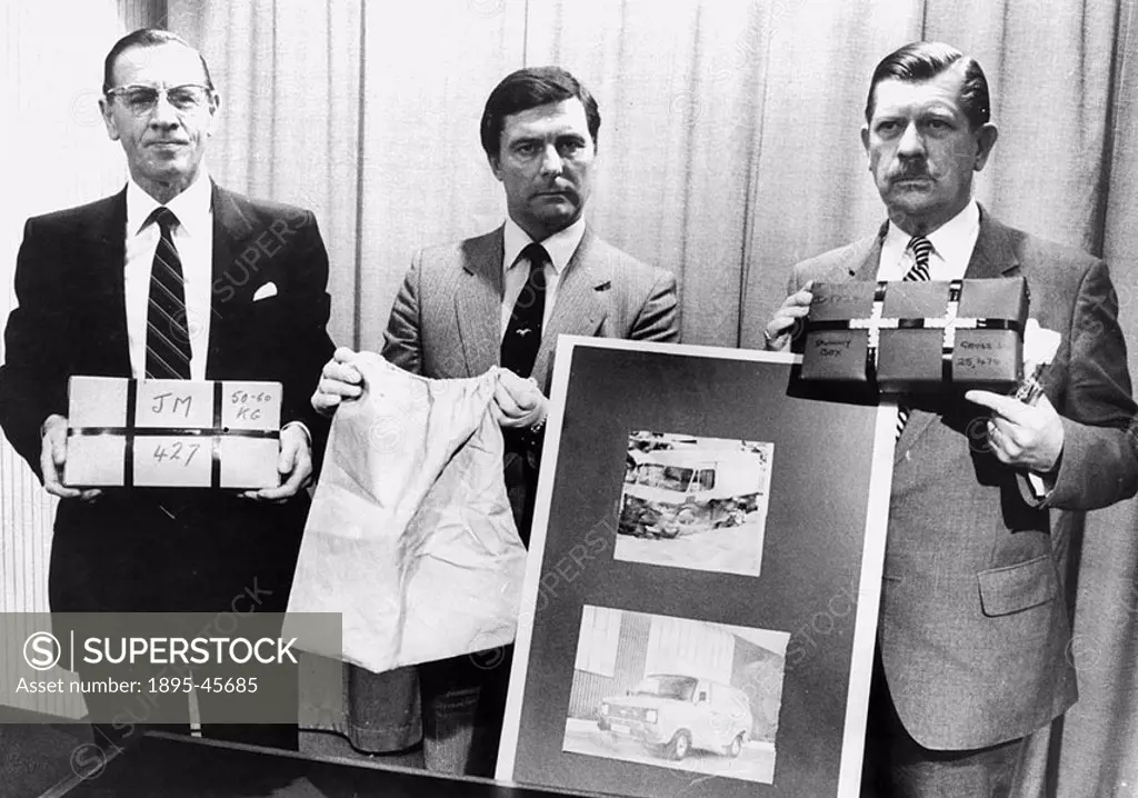 Police with items used in a gold robbery, c 1983 Left to right: Commander Frank Carter holding tape of box the gold was put in  Detective Superintende...