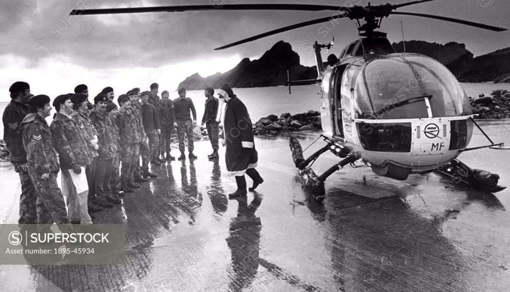 Father Christmas arrives by helicopter to St Kilda, Scotland.