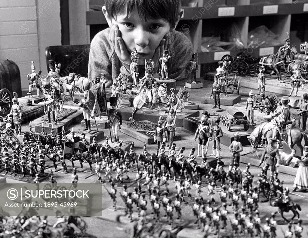 Six-year-old David Hinchcliffe with £1000 worth of model soldiers at the workshop of Frank X Hinchcliffe no relation, who makes the models in a conve...