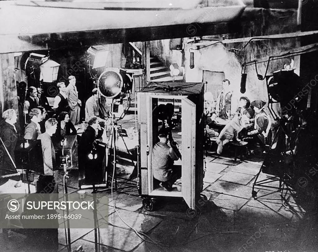Early sound studio with cine camera encased in sound-proof booth, c 1920
