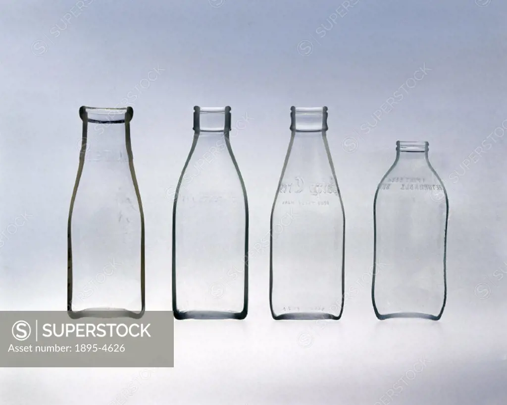 The bottles are arranged in order of age, with the oldest on the left. These milk bottles show how the amount of glass used to make a reuseable milk b...