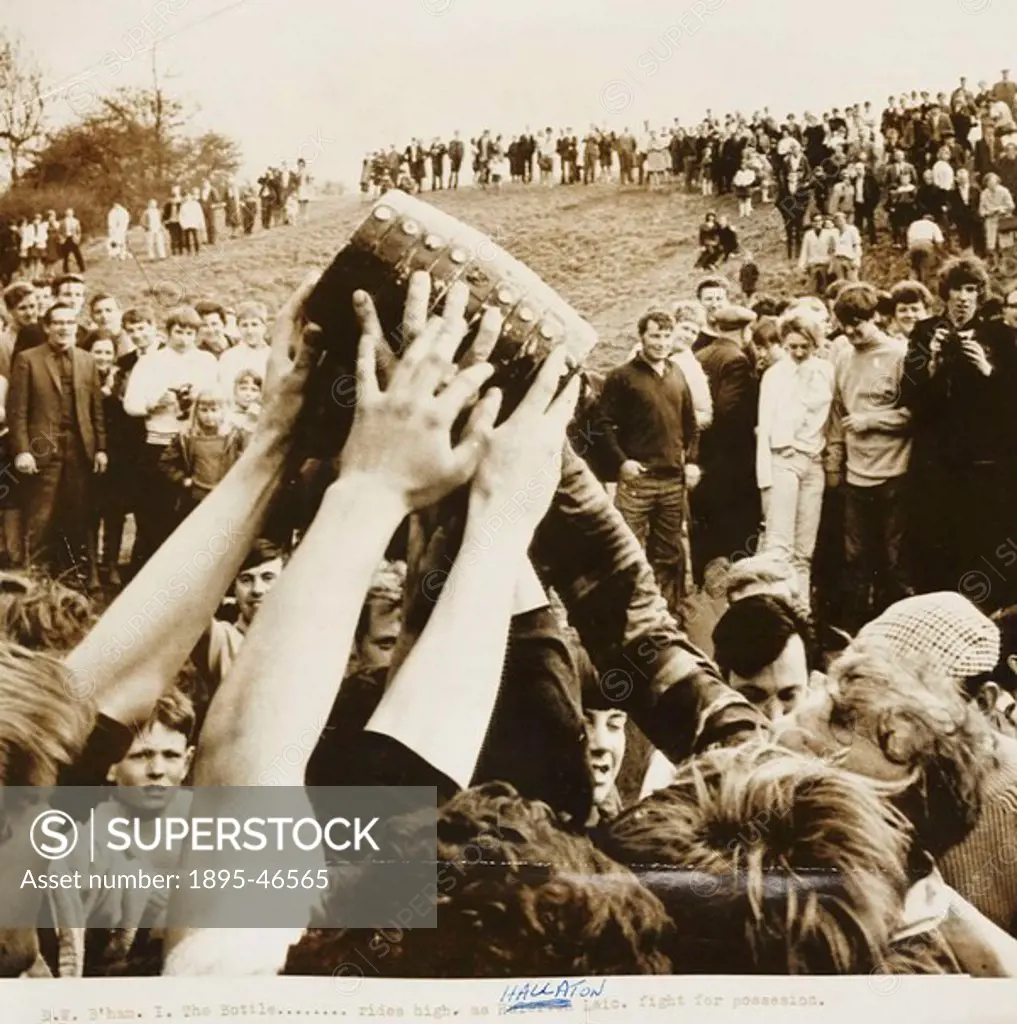 A photograph of players fighting for possession of the ´bottle´ during the bottle-kicking and hare pie scramble in Hallaton, Leicestershire, in 1968  ...