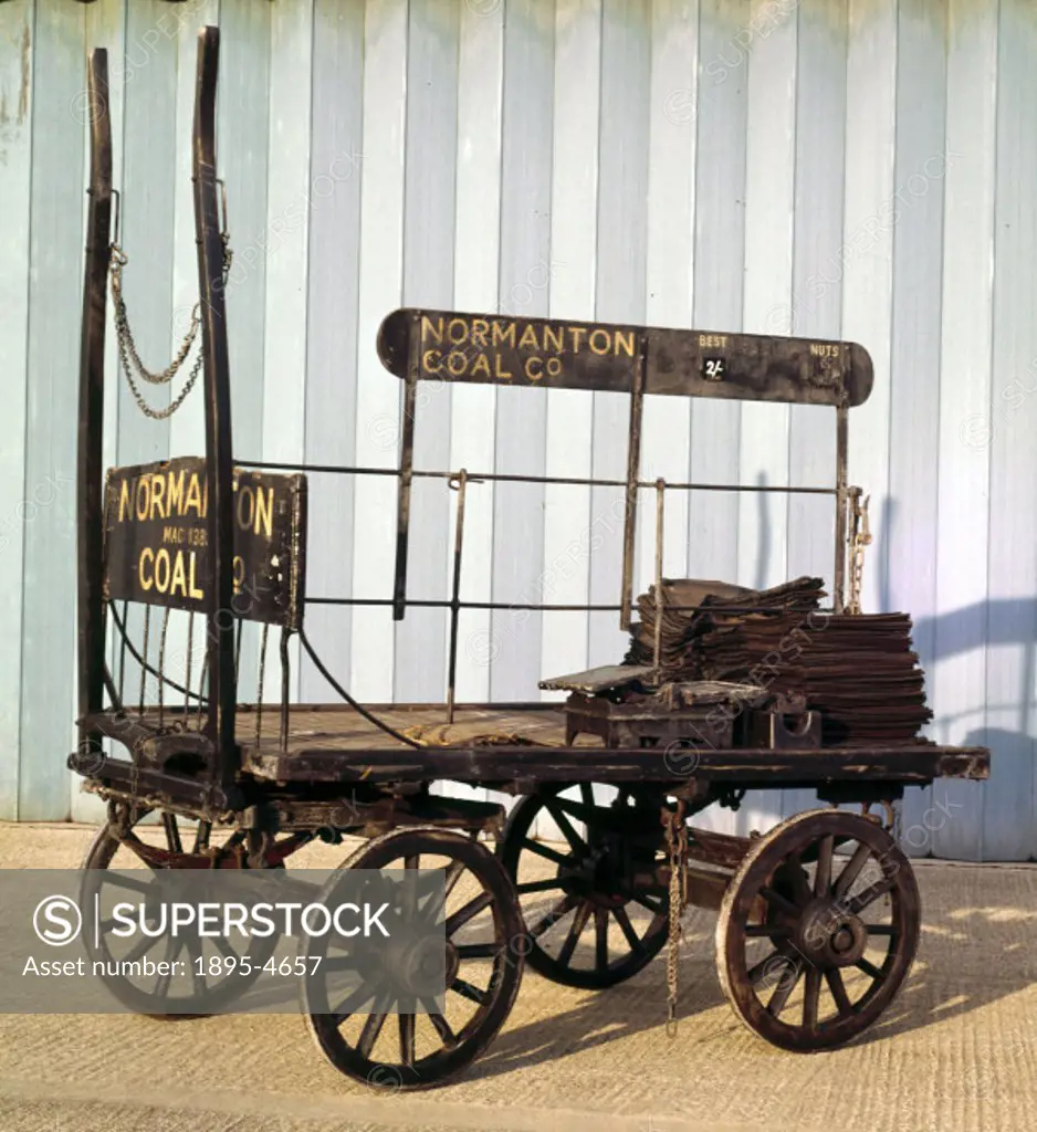 This horse-drawn cart was designed to be pulled by one horse and to carry a two-ton load of coal in sacks. The flat, open platform gave good access to...