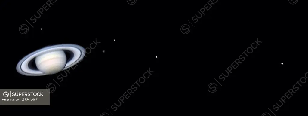 Saturn´s moons, 2004 This image showing Saturn with five of its moons was taken on 20 December 2004 at 01:29 hrs UT using a webcam attached to a 10-in...