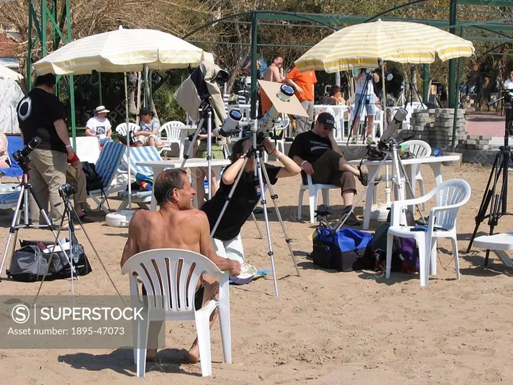 Total eclipse of the Sun, Turkey, 29 March 2006 Eclipse watchers gather on the beach near Side in Southern Turkey and prepare to observe and photograp...