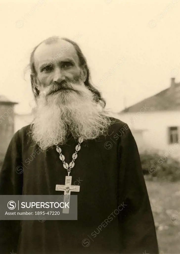 Orthodox priest, Balkans, Second World War, 1940s A Christian orthodox priest wearing a large crucifix