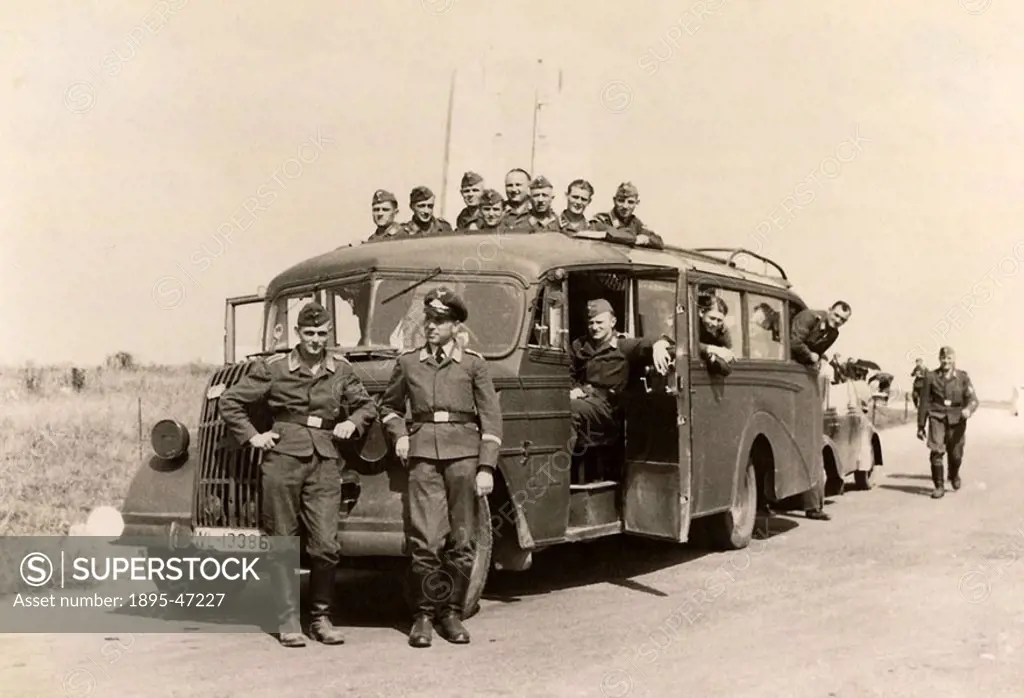 Luftwaffe airmen with bus, Second World War, 1940s Members of the German air force posing with their bus