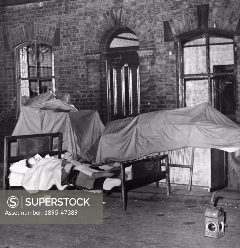 Dutchman Arnold Leeseman and his father-in-law sleeping outside no 36 Layard Street, Greater Manchester  Police put red warning lamps to alert traffic...
