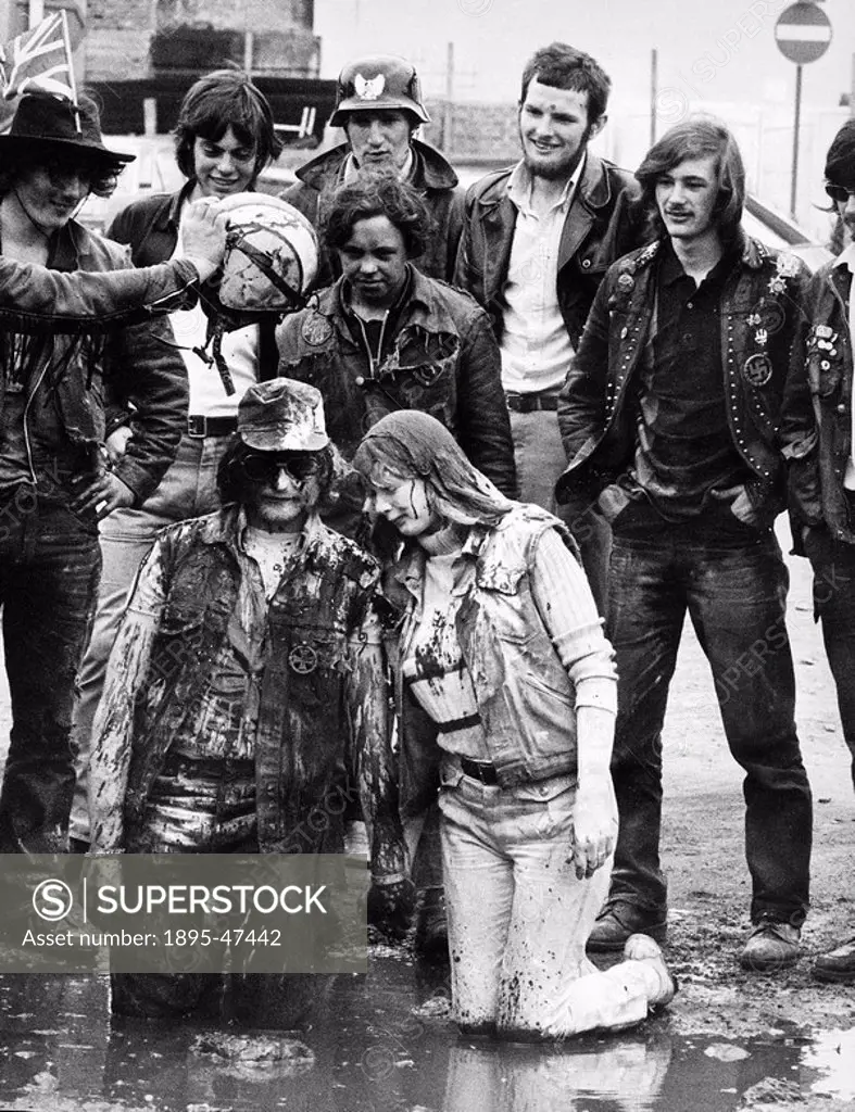 Hells Angel baptism, July 1971 Newly-married Golly and Sugar are baptised by Scouse, watched by their biker friends 