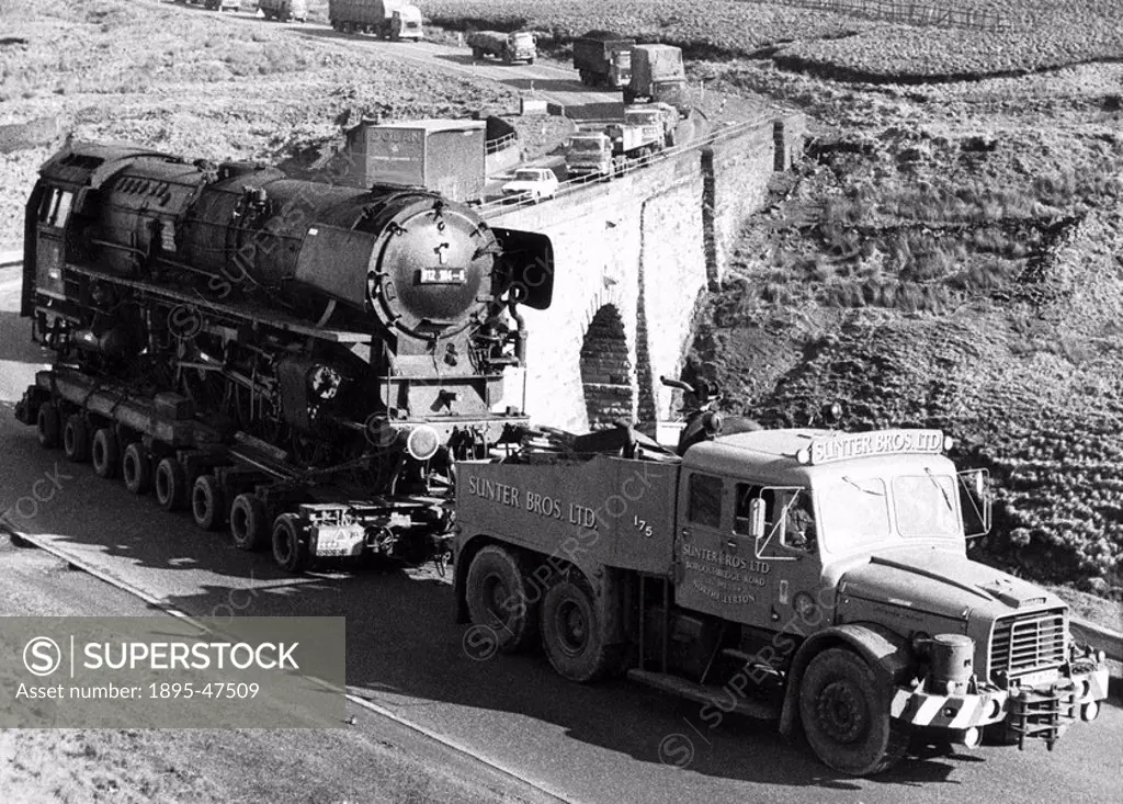 Hitlers train, February 1975 Adolf Hitlers personal locomotive being transported by Sunter Brothers Ltd to the steam engine museum at Carnforth, Lan...